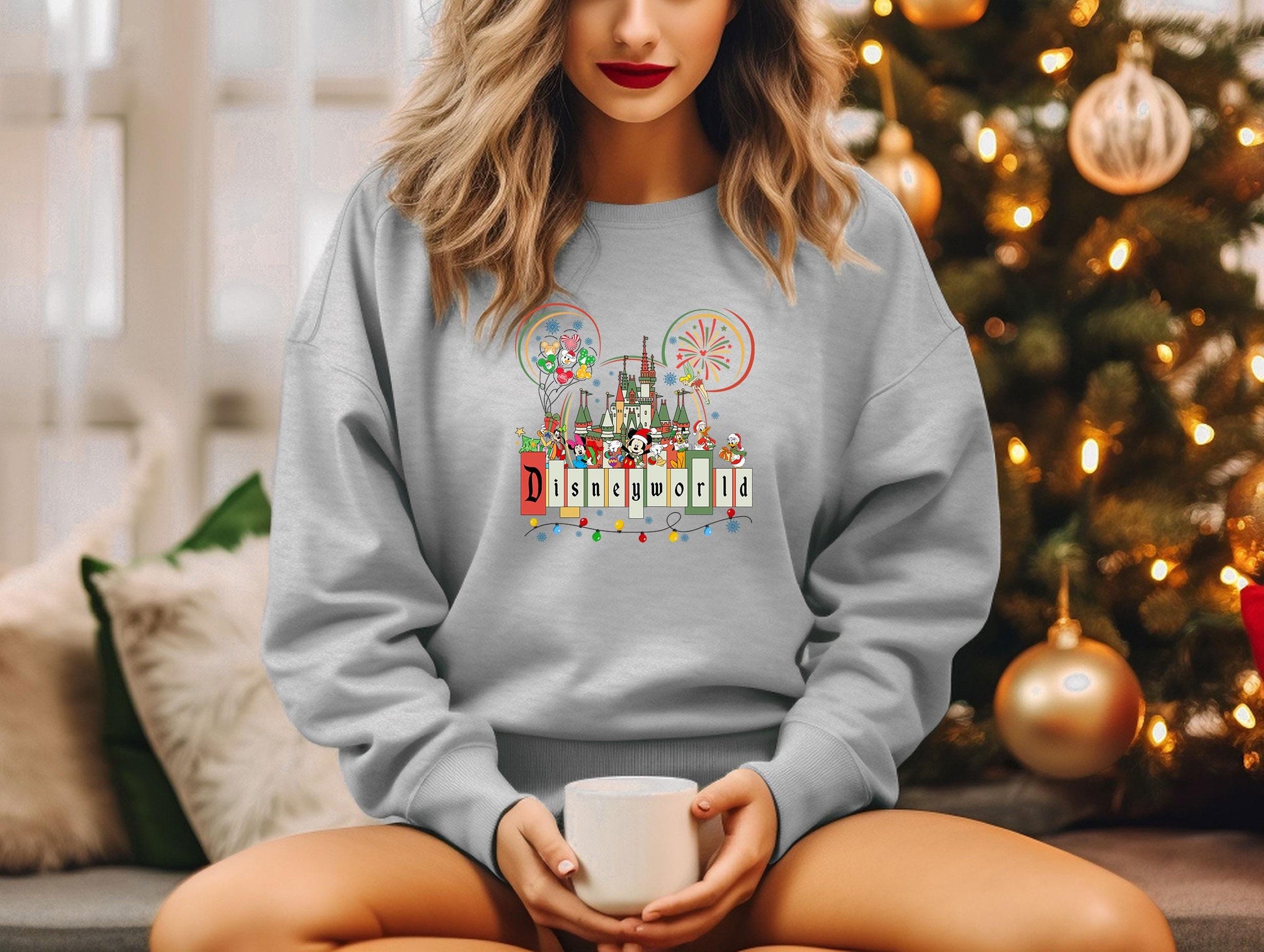 a woman sitting on a couch holding a coffee mug