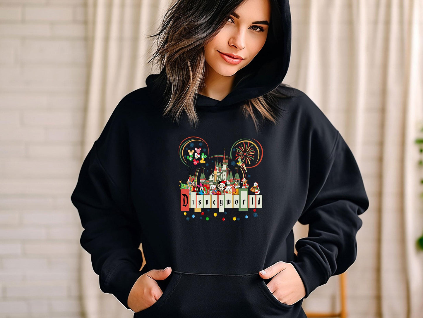 a woman wearing a black mickey mouse hoodie