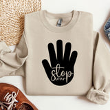 a sweater with a hand print on it