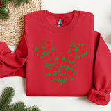 a red sweater with a mickey mouse design on it