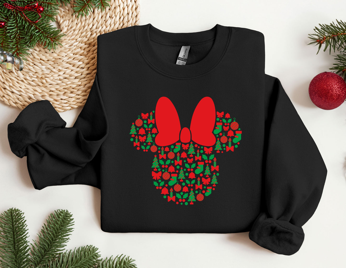 a mickey mouse christmas sweater with a bow on it