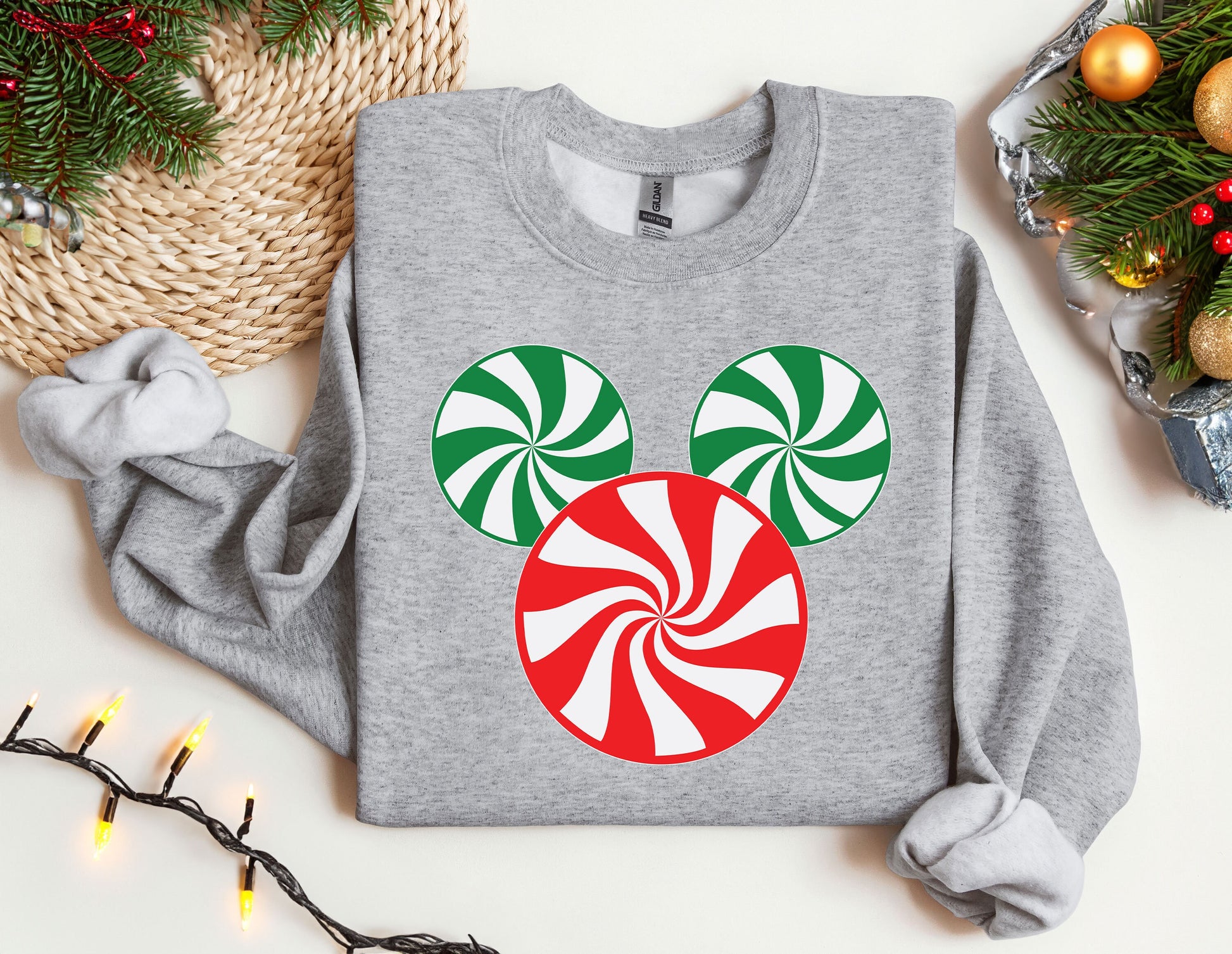 a mickey mouse christmas sweater with candy canes on it