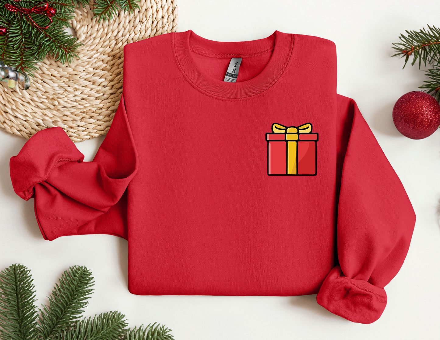 a red sweater with a present on it