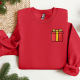 a red sweater with a present on it
