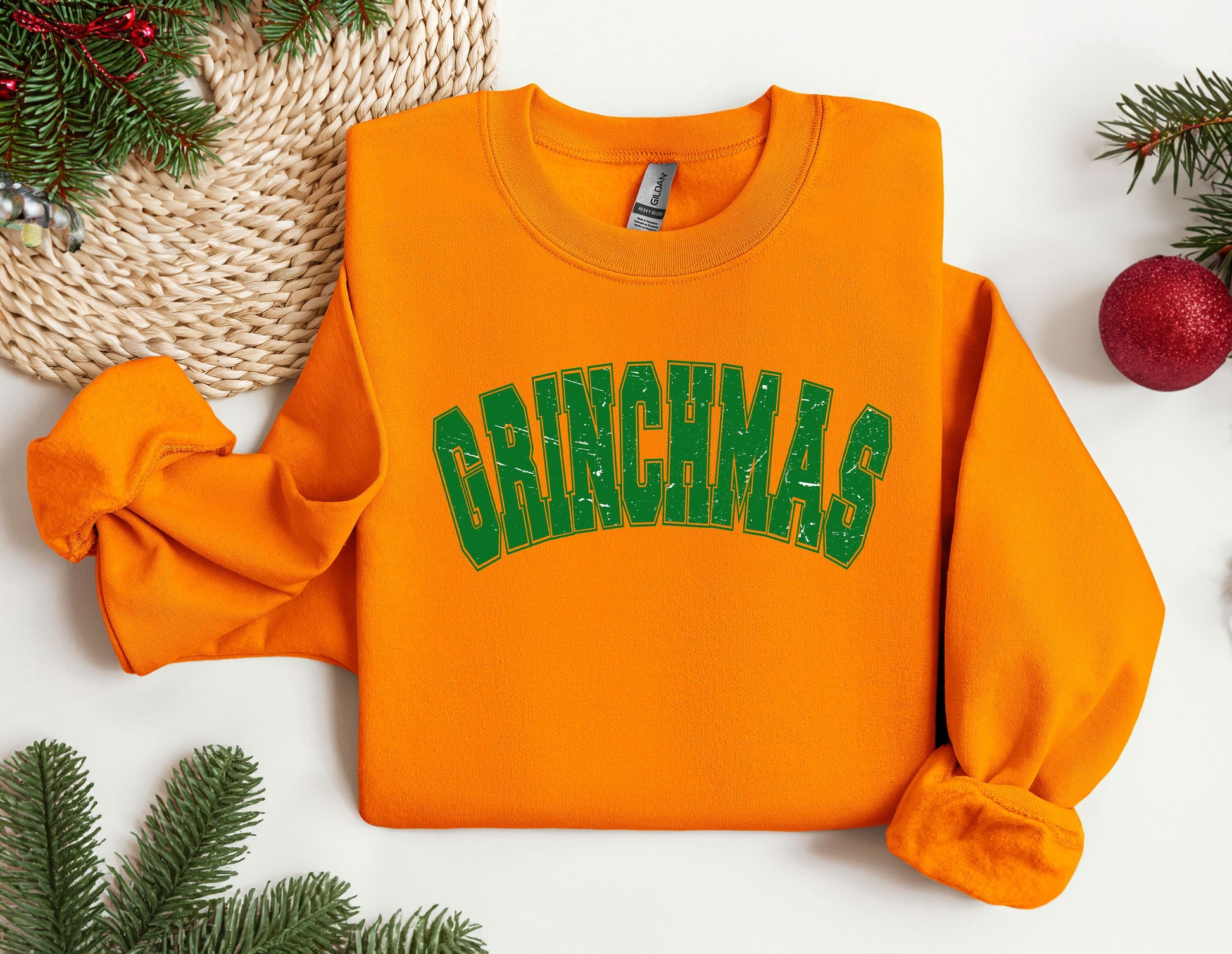 an orange sweatshirt with the word grinnas on it