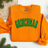 an orange sweatshirt with the word grinnas on it