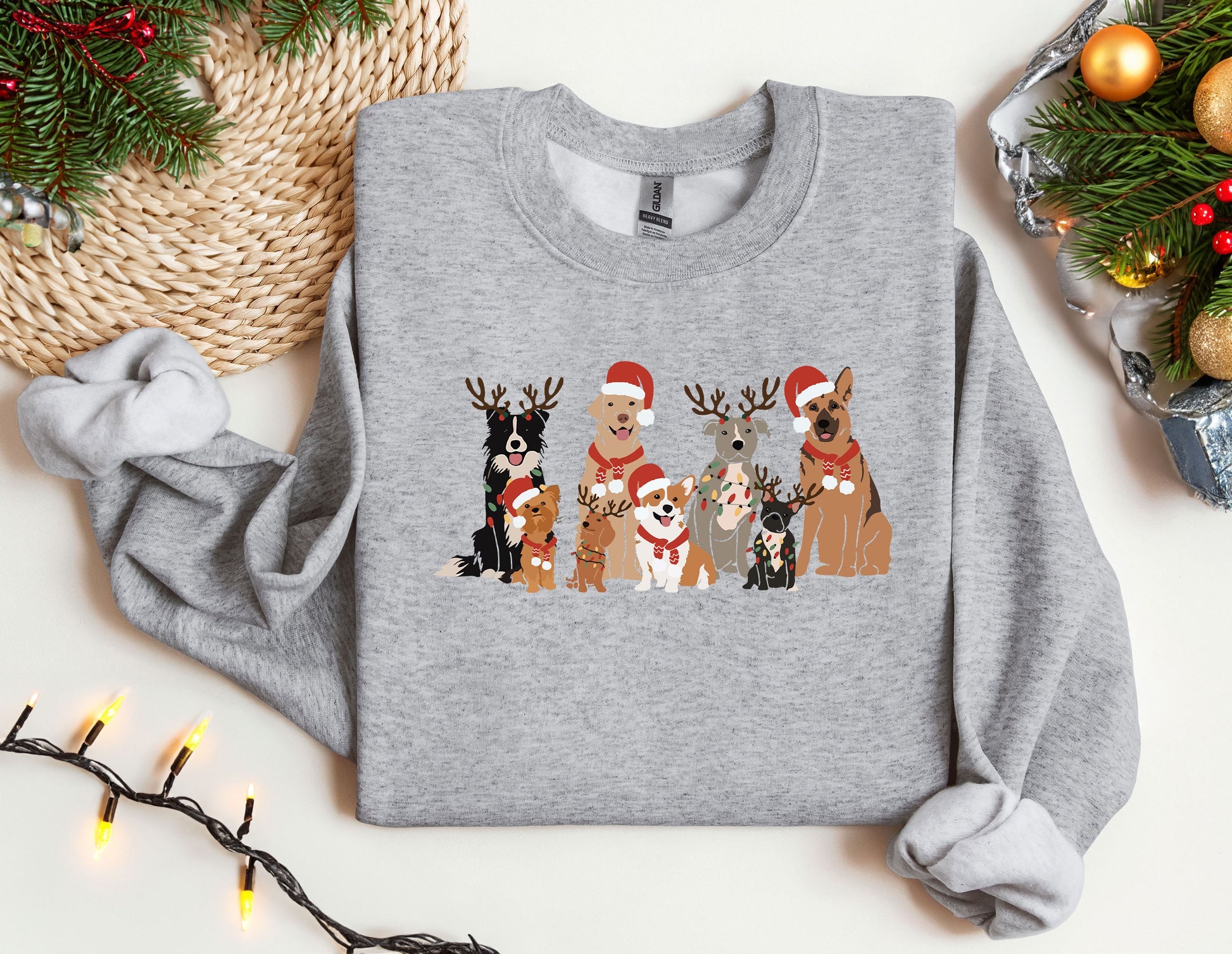 a group of dogs wearing christmas sweaters next to a christmas tree