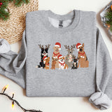 a group of dogs wearing christmas sweaters next to a christmas tree