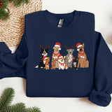 a group of dogs wearing christmas sweaters on a table