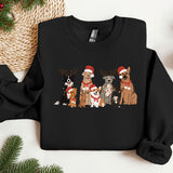 a group of dogs wearing christmas sweaters on a table