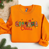 an orange sweatshirt with the word grandma claus on it