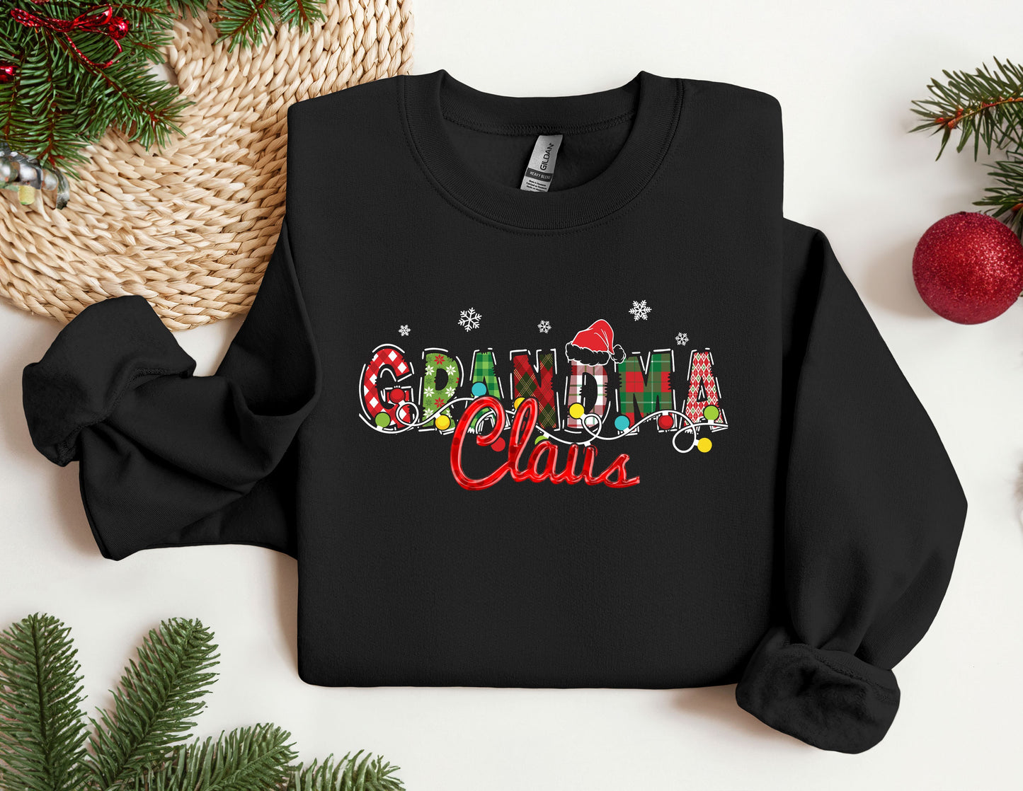 a black sweatshirt with the word grandma written in multicolored letters