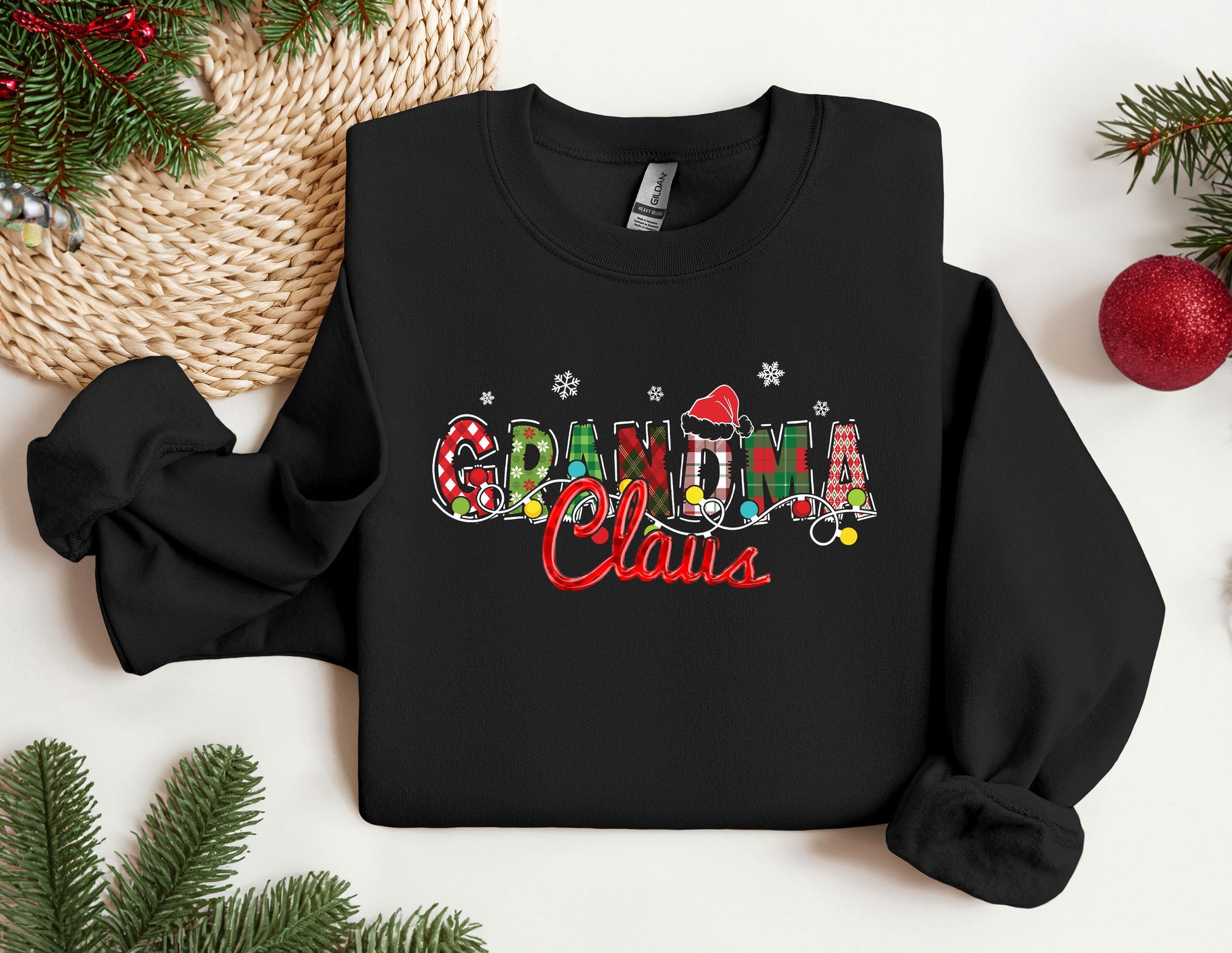 a black sweatshirt with the word grandma written in multicolored letters