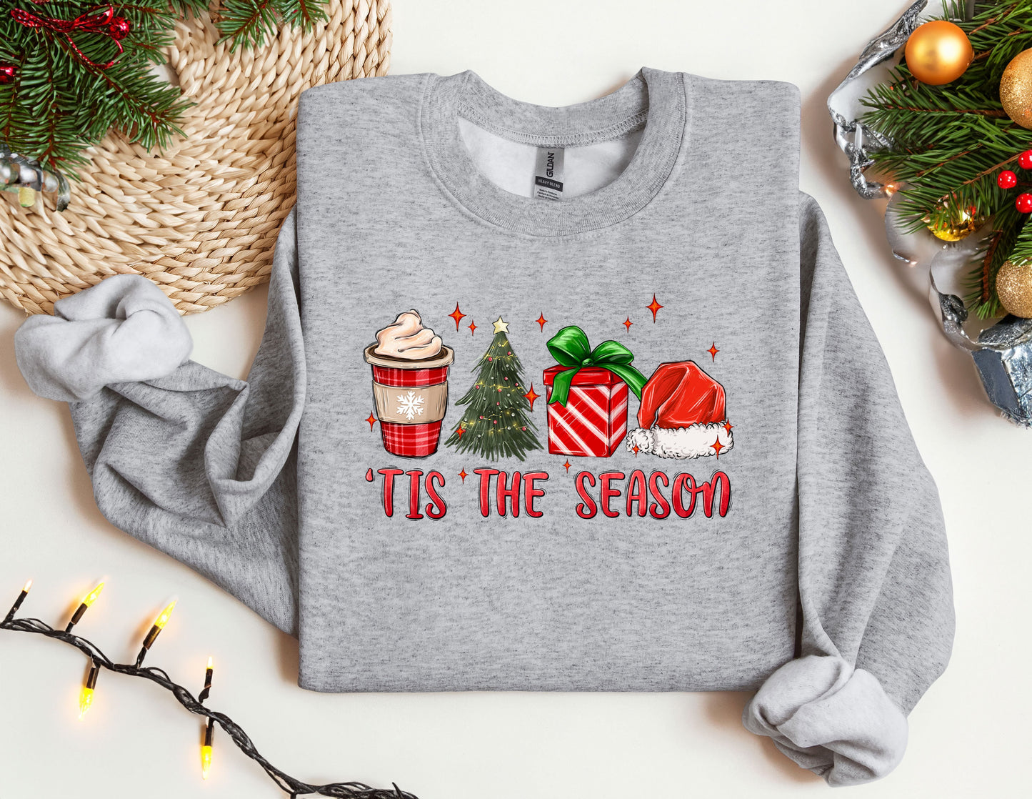 a christmas sweater with a cup of coffee and a christmas tree