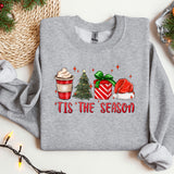 a christmas sweater with a cup of coffee and a christmas tree
