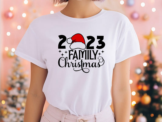 a woman wearing a white t - shirt with a santa hat on it