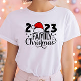 a woman wearing a white t - shirt with a santa hat on it