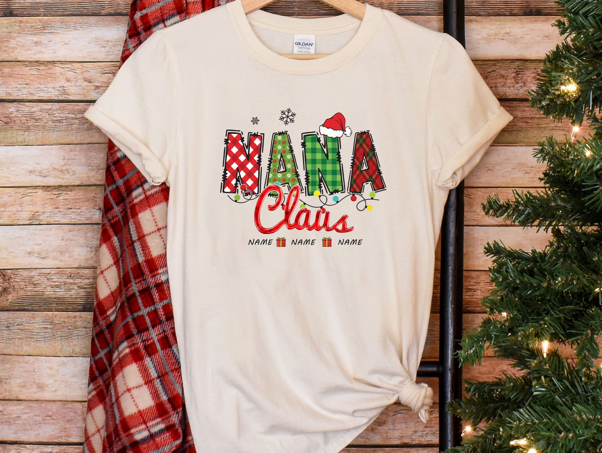 a white t - shirt with the word santa claus on it