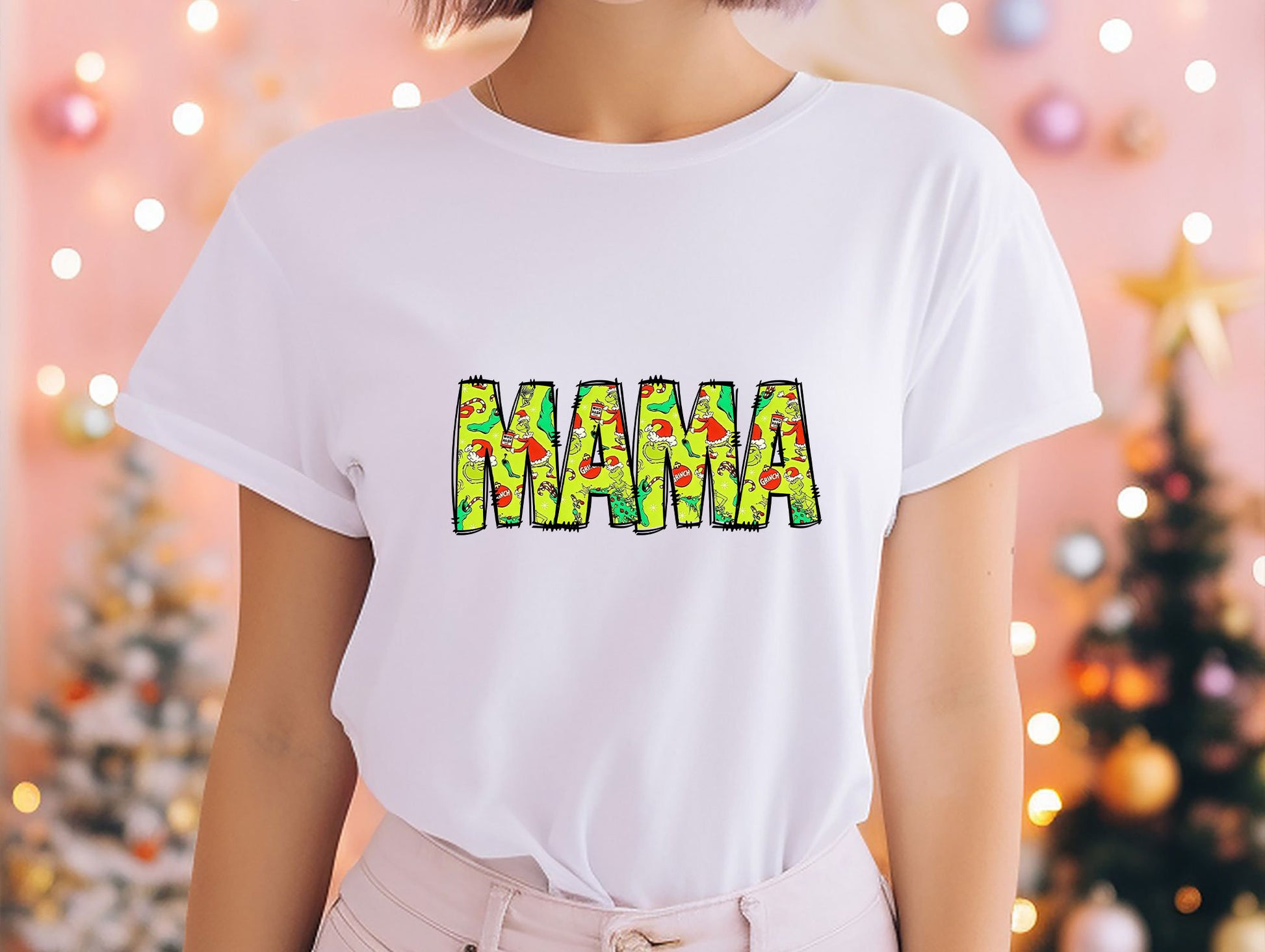 a woman wearing a white shirt with the word mama printed on it