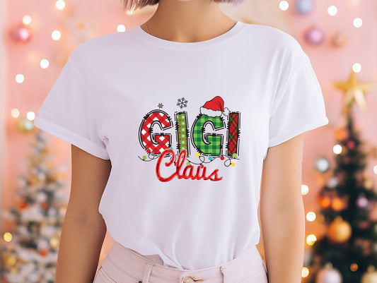 a woman wearing a white t - shirt with the word guli claus printed on