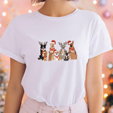 a woman wearing a white t - shirt with dogs on it
