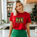 a woman in a red shirt is standing in a kitchen