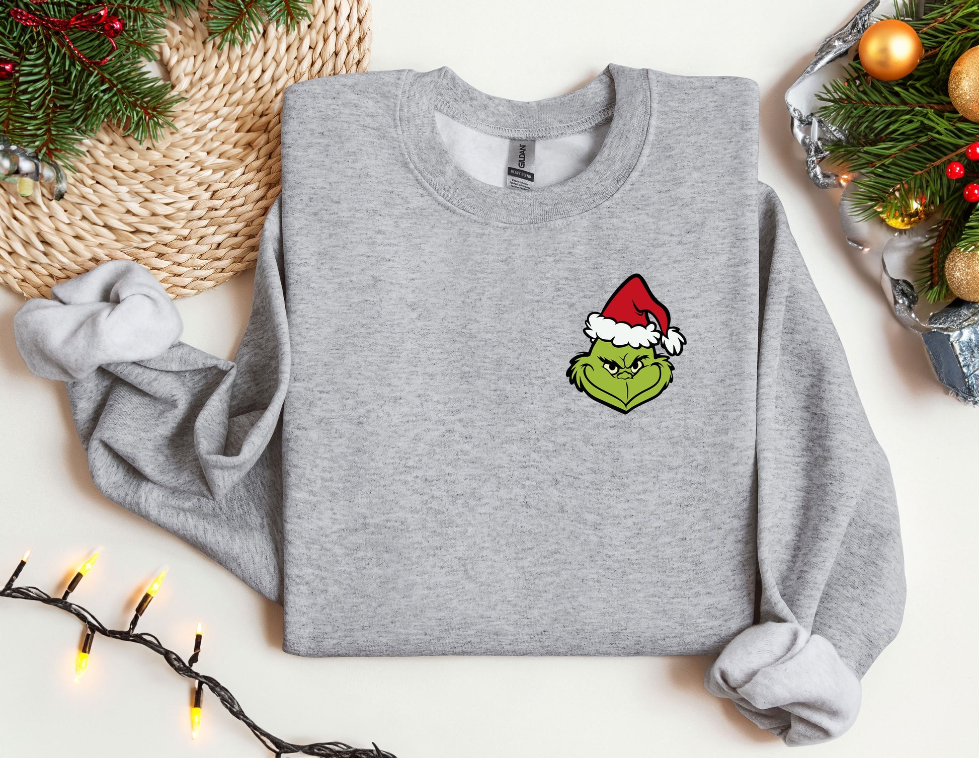 a grey sweatshirt with a christmas hat on it