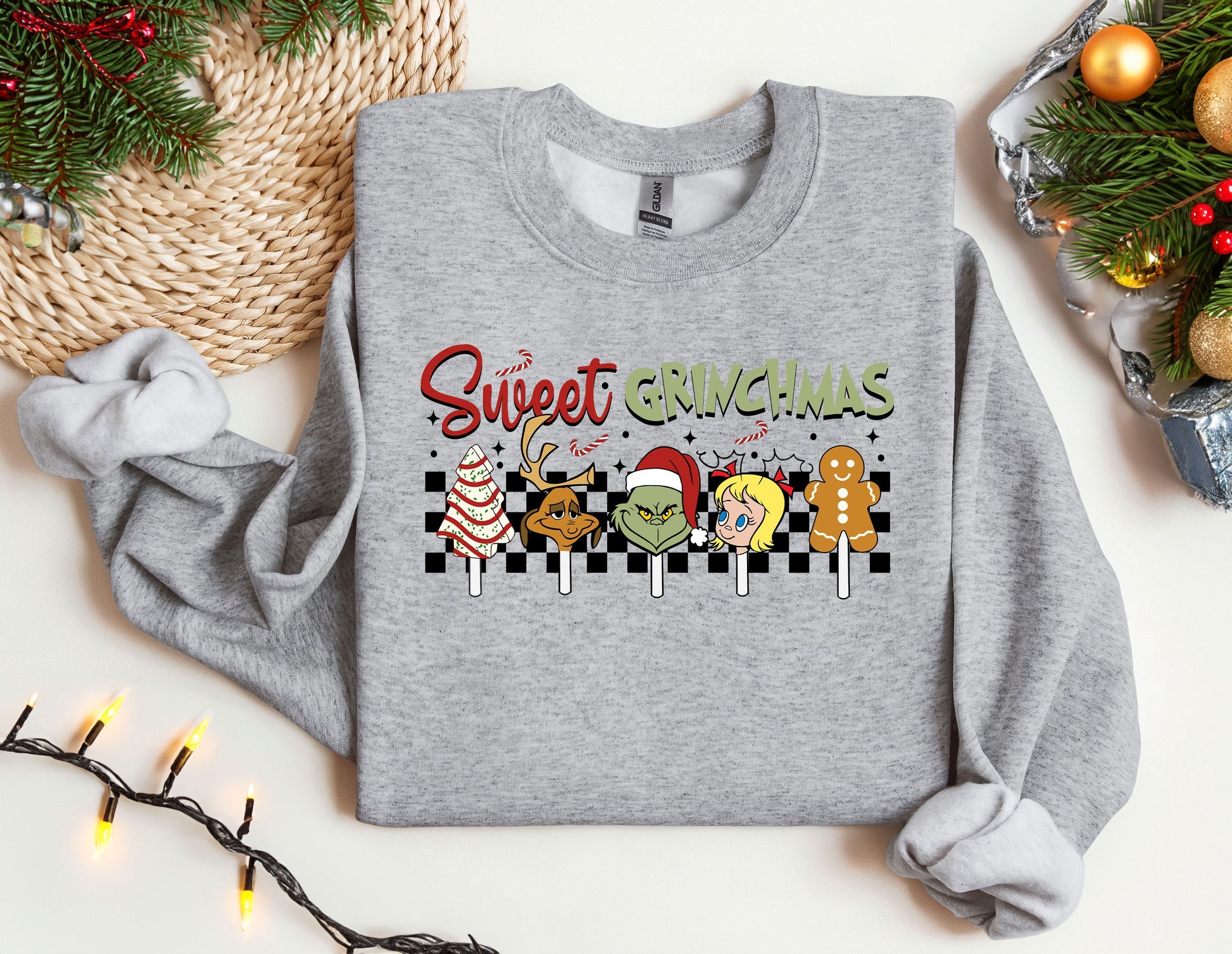 a grey sweatshirt with a christmas message on it