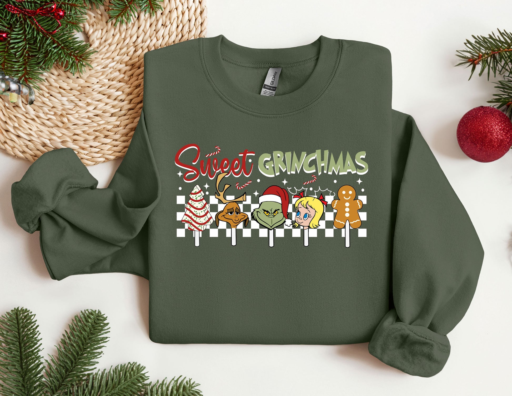 a green sweater with a christmas message on it