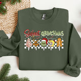 a green sweater with a christmas message on it
