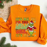 an orange shirt with a grin face on it
