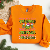 an orange sweatshirt with the grin on it