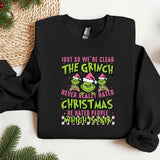 a black sweater with a grin face on it