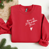 a red sweater with a heart on it