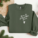 a green sweatshirt with white writing on it