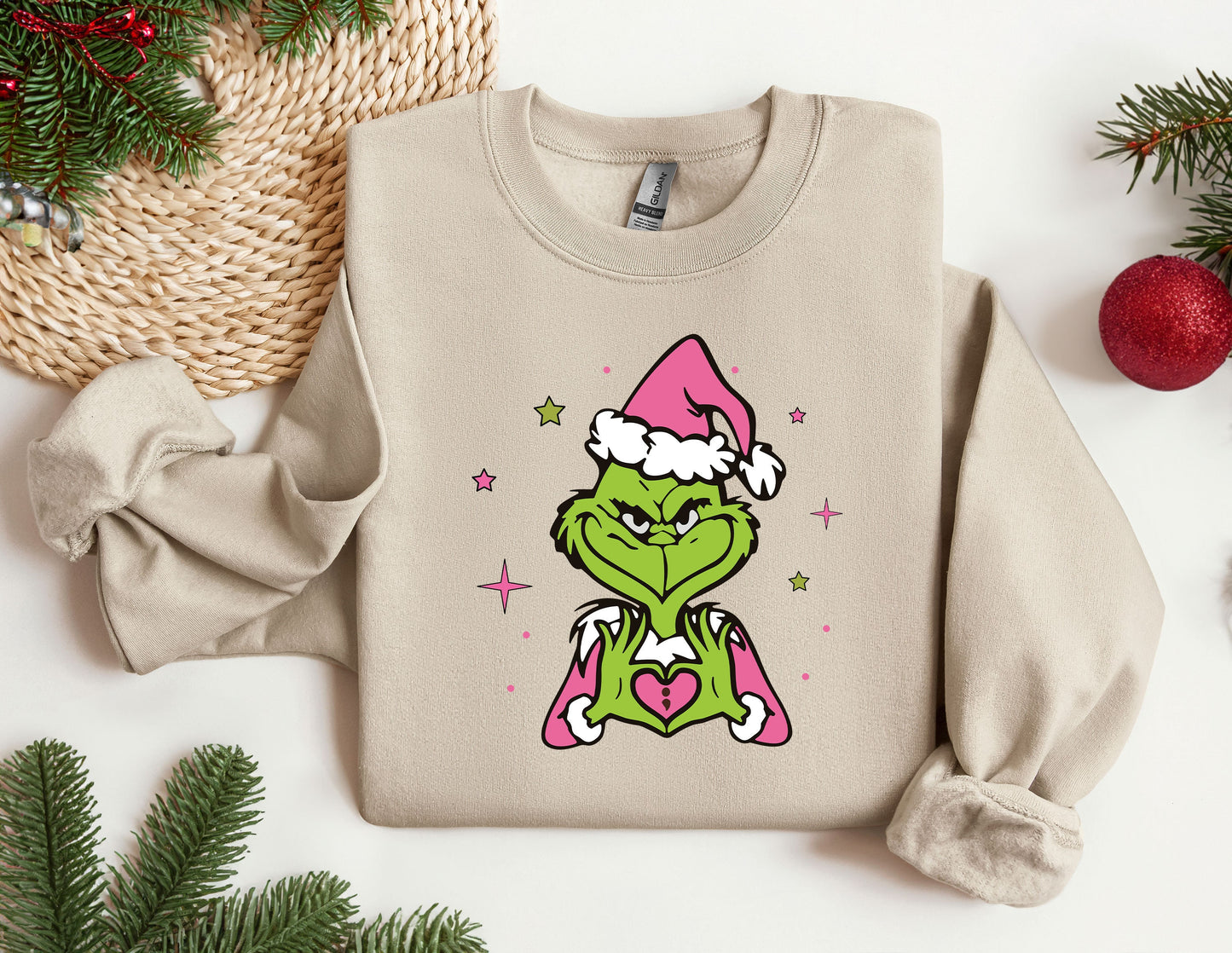 a sweater with the grin face wearing a santa hat