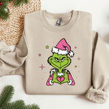 a sweater with the grin face wearing a santa hat