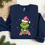 a blue sweatshirt with a cartoon of a grin face wearing a santa hat