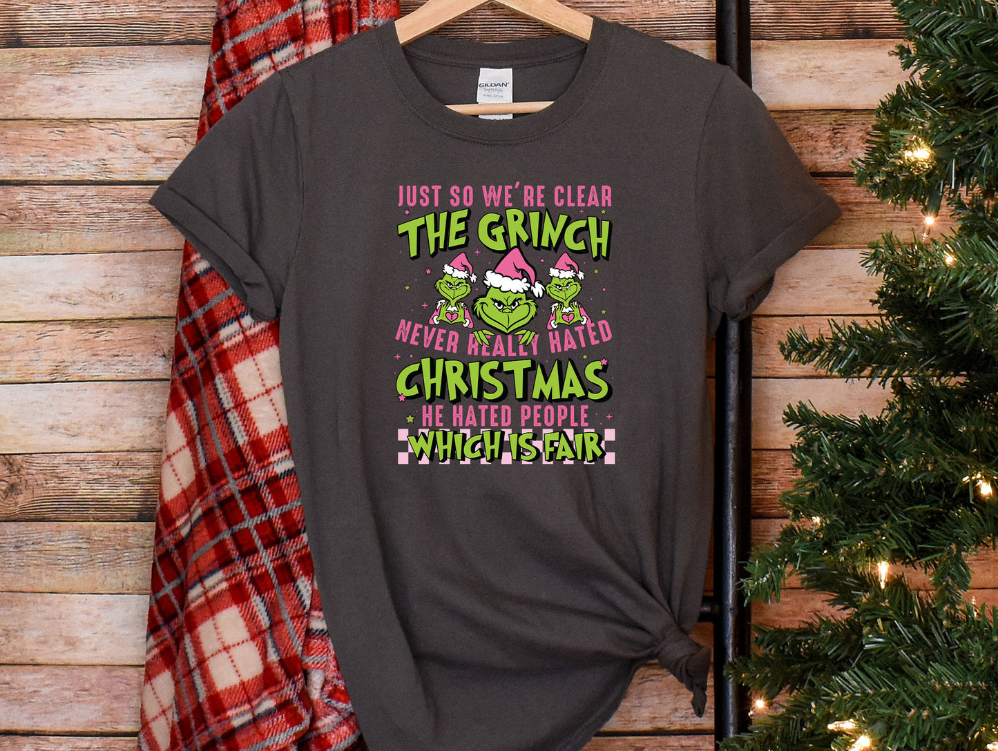 a t - shirt that says, just so we&#39;re wearing the grinch