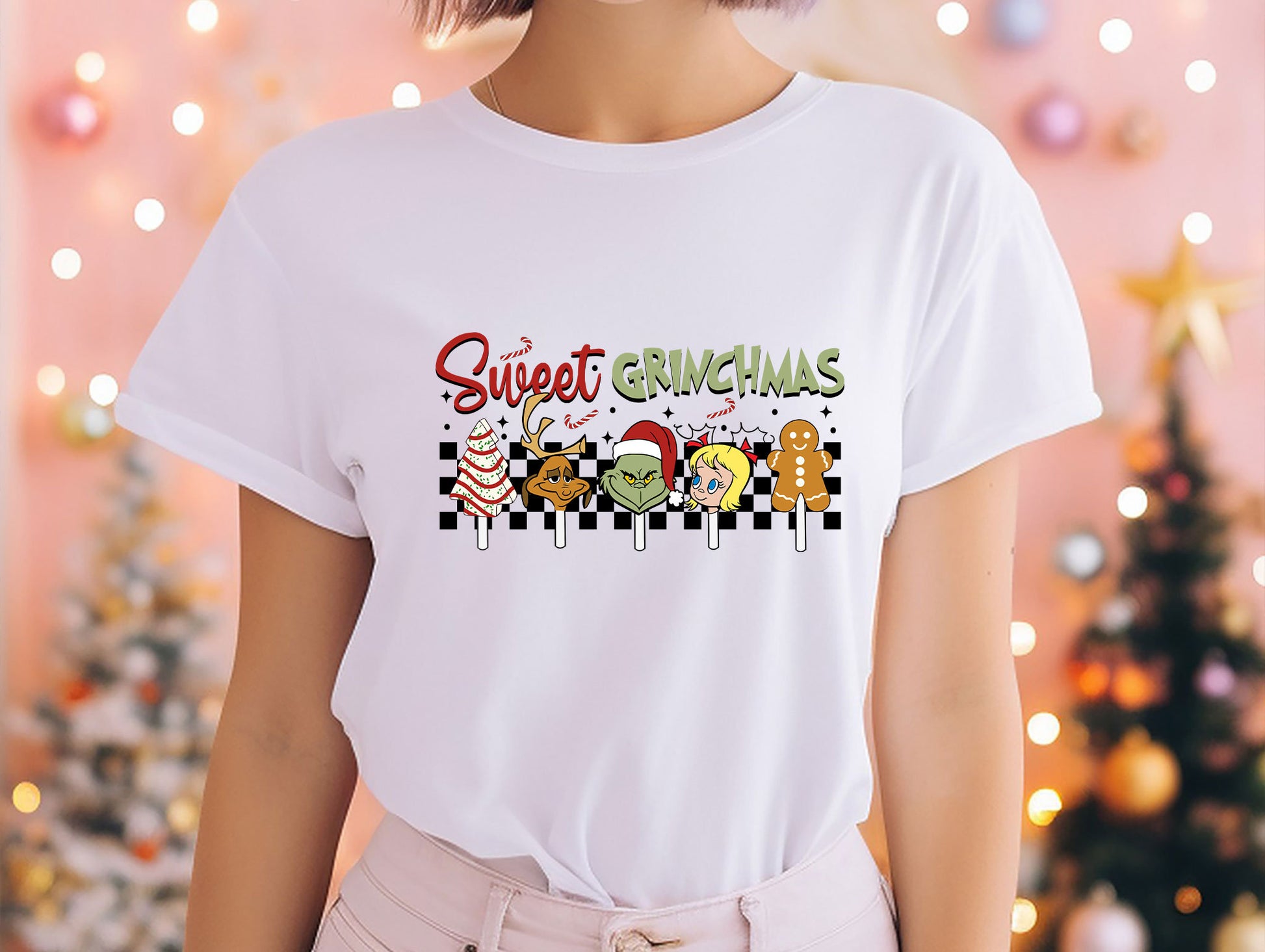 a woman wearing a t - shirt that says sweet christmas