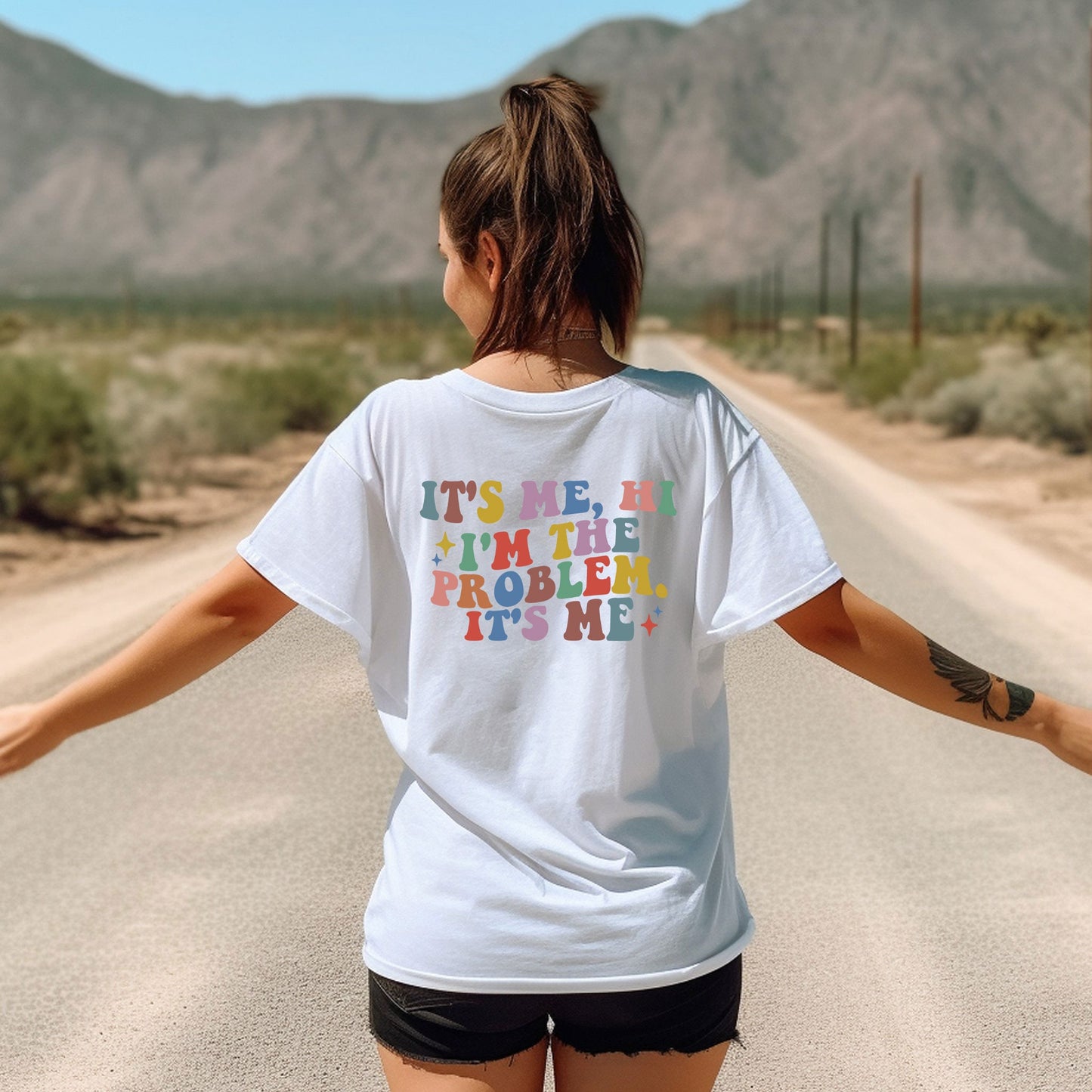 a woman walking down a road with her arms outstretched