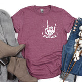 a t - shirt with the words moon rules on it next to a pair of