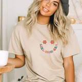 a woman sitting on a bed with a cup of coffee