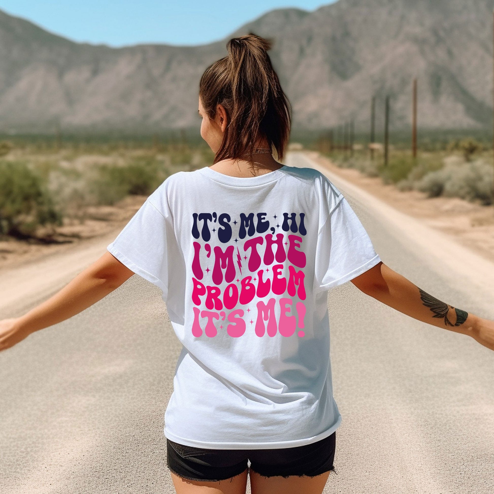 a woman walking down a road with her arms outstretched