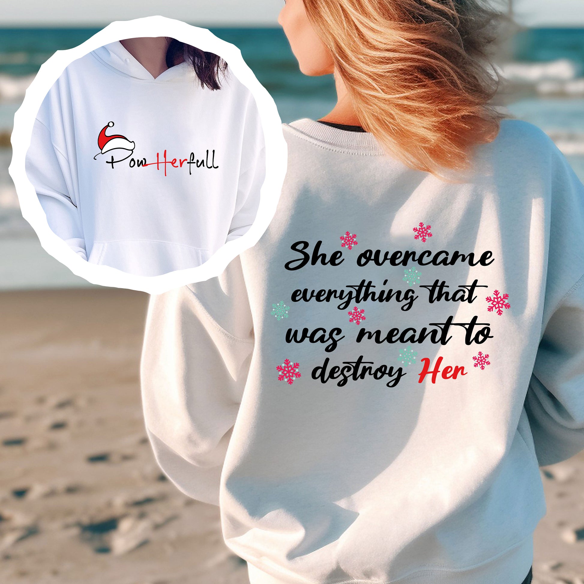 a woman standing on a beach wearing a sweatshirt