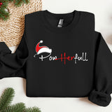 a black sweatshirt with a santa hat on it