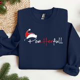 a blue sweatshirt with a santa hat on it