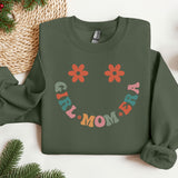 a green sweatshirt with a smile drawn on it
