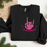 a black sweatshirt with a pink design on it