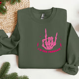 a green sweater with a pink hand print on it